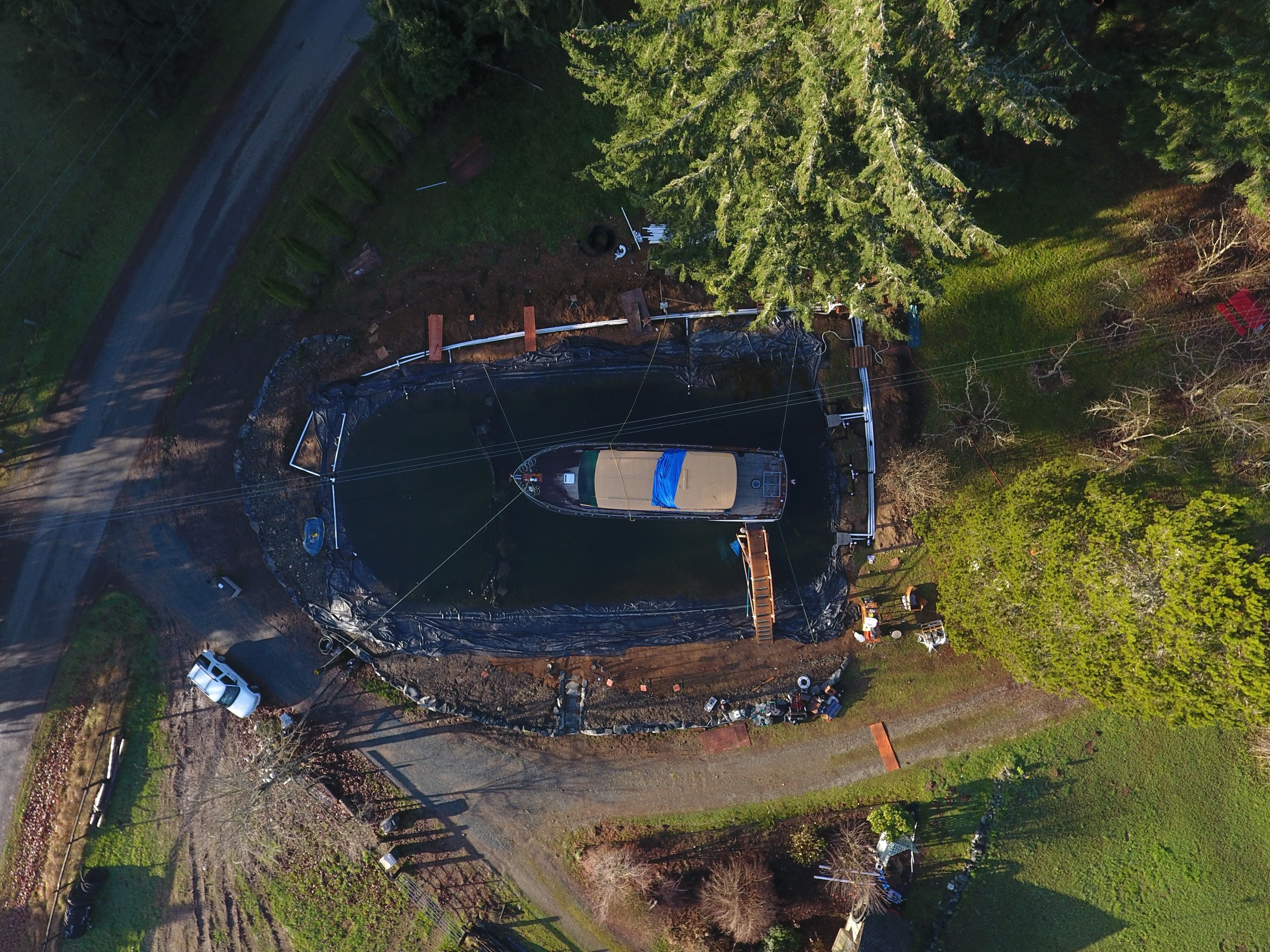 Aerial view of a pond and boat under construction at Daybreak Farm